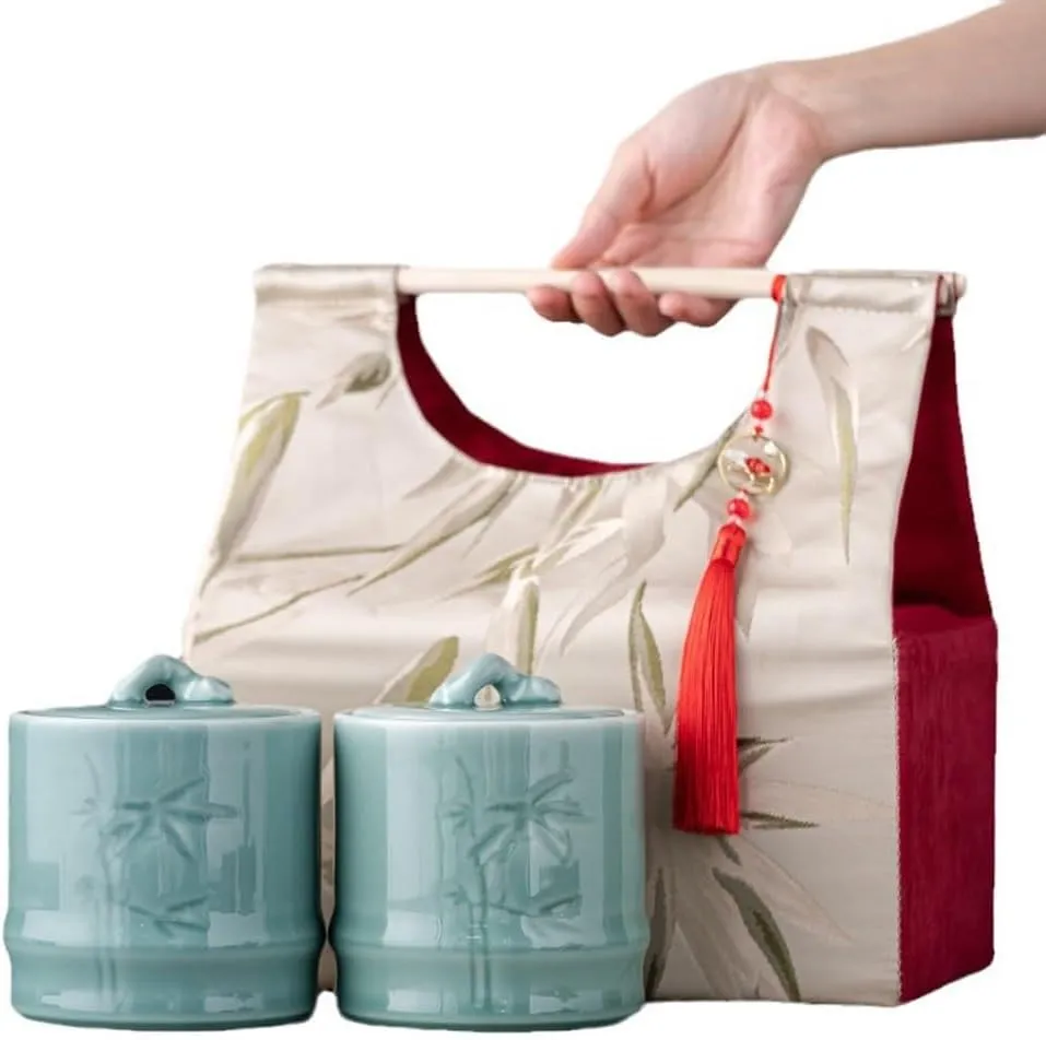 Tea Storage Jar Ceramic tea cans, moisture-proof sealed tea cans, creative hand-held cloth bag gifts Food Storage Containers